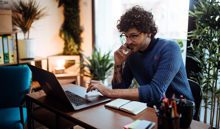 young man in home office