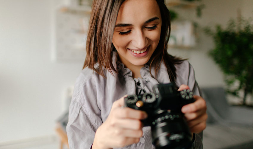 woman holding a camera