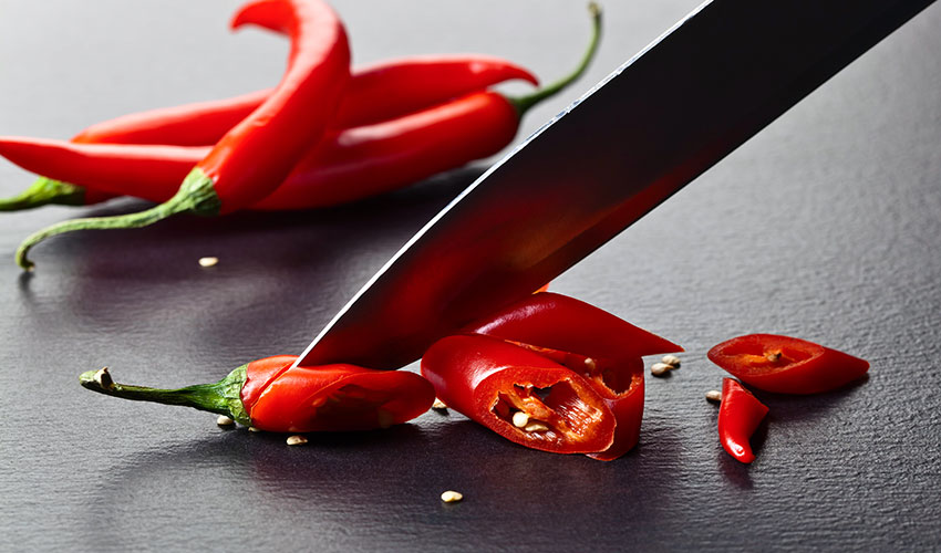 chopping red peppers