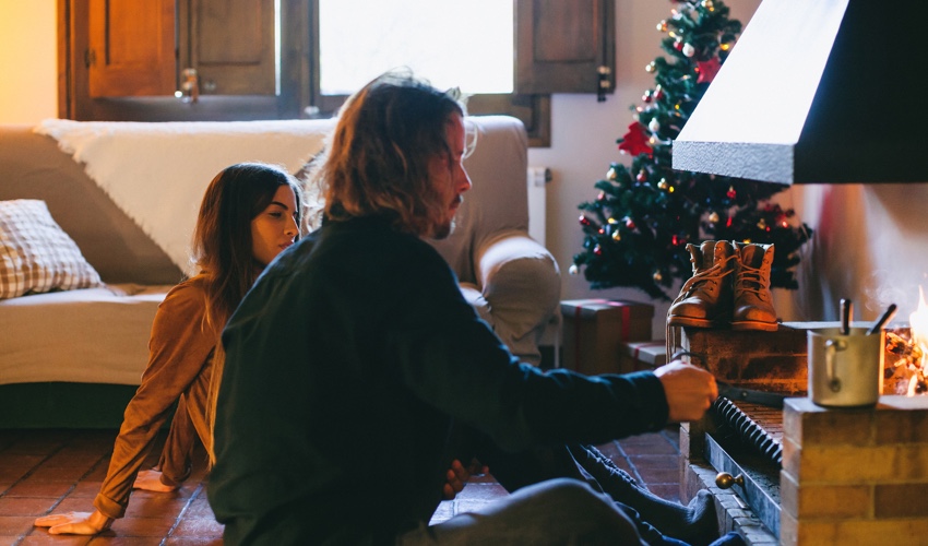 a man and a woman sitting on a table