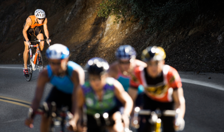 a group of people in a professional bike race