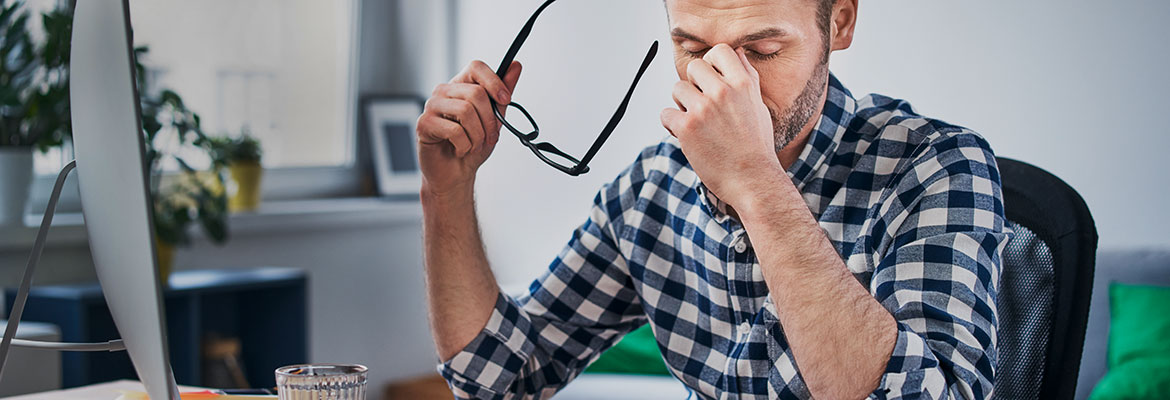 Tired man at desk