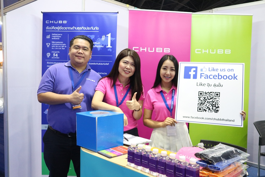 a group of people standing in front of a box