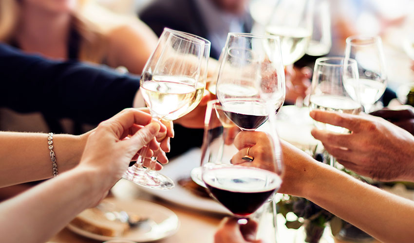 toasting with wine glasses