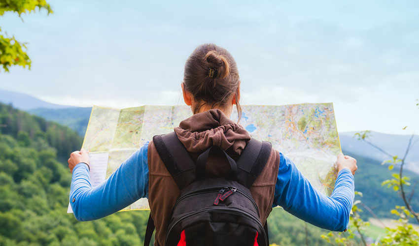 hiker reads a map