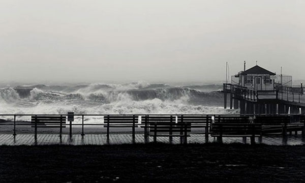 a close up of a pier next to a body of water