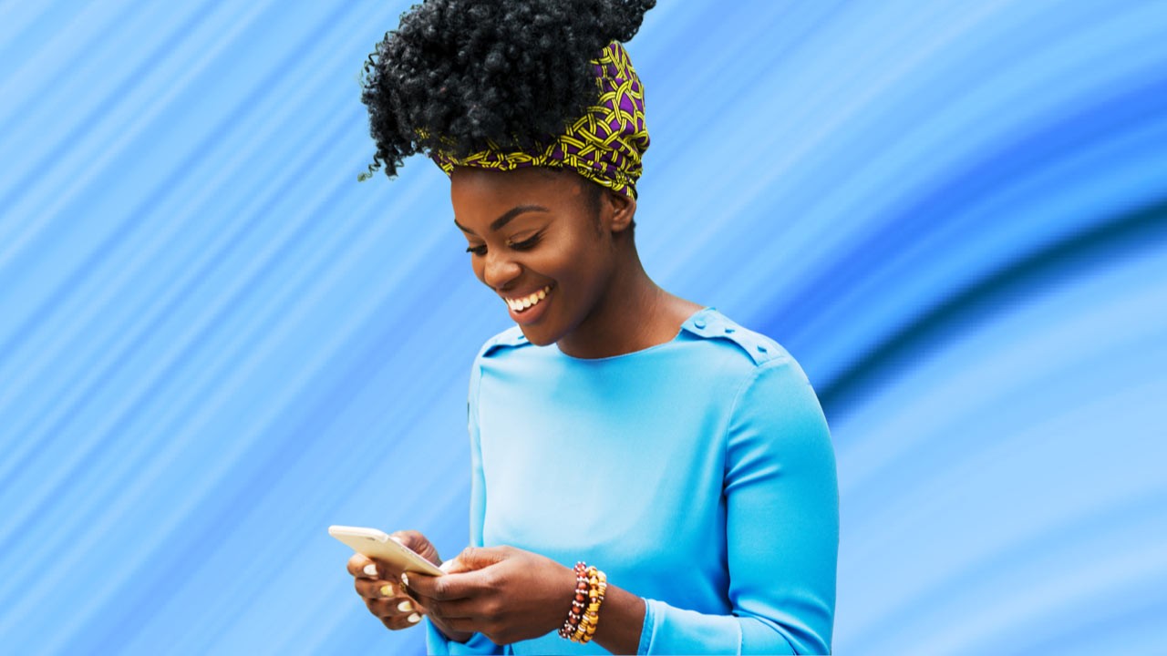 Woman on mobile phone purchasing digital insurance.